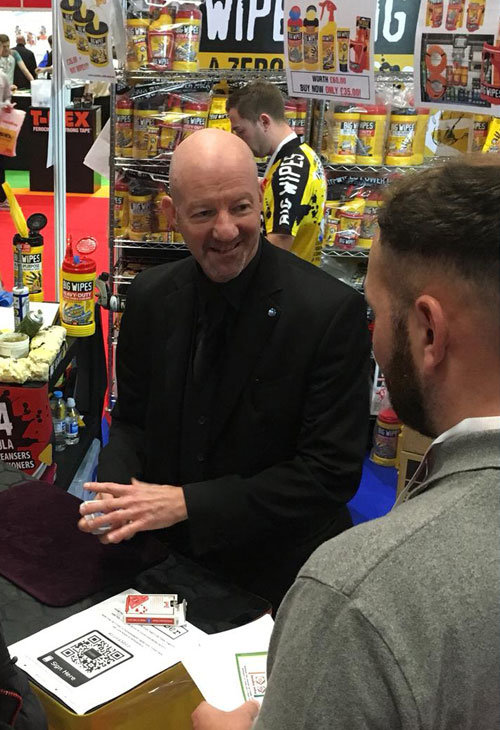 Magician Doing A {rpdict Demonstration At A Trade Show